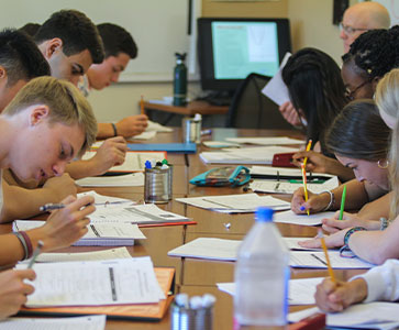 Photo of students in class. Links to Gifts of Life Insurance