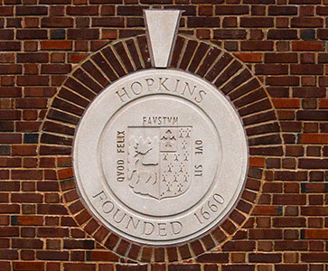 Photo of the seal in a brick wall. Links to Gifts of Cash, Checks, and Credit Cards